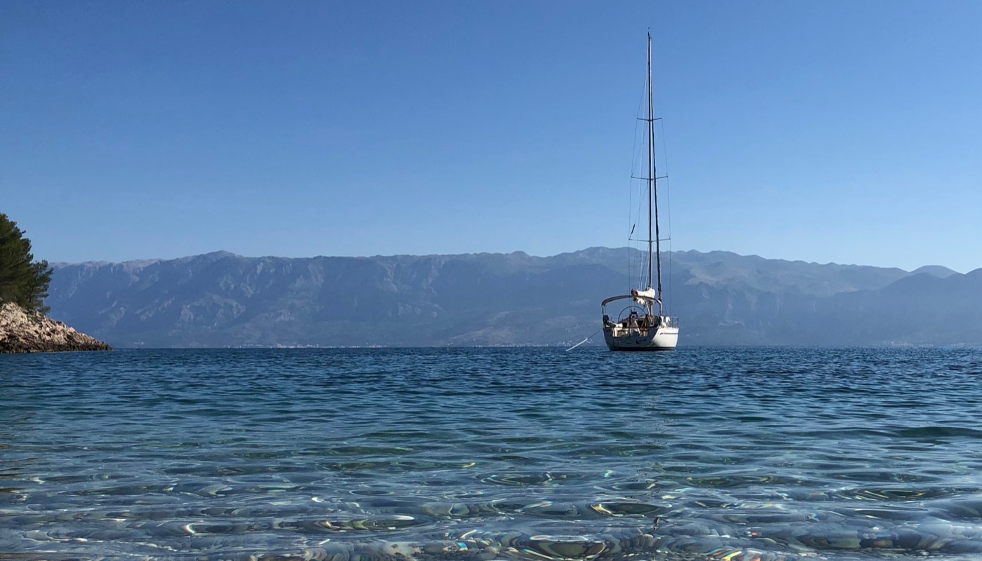 Sailing yacht in a clear Mediterranean bay